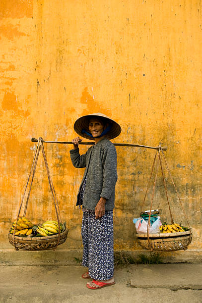 istock vietnamese woman copy space yellow wall 182174331