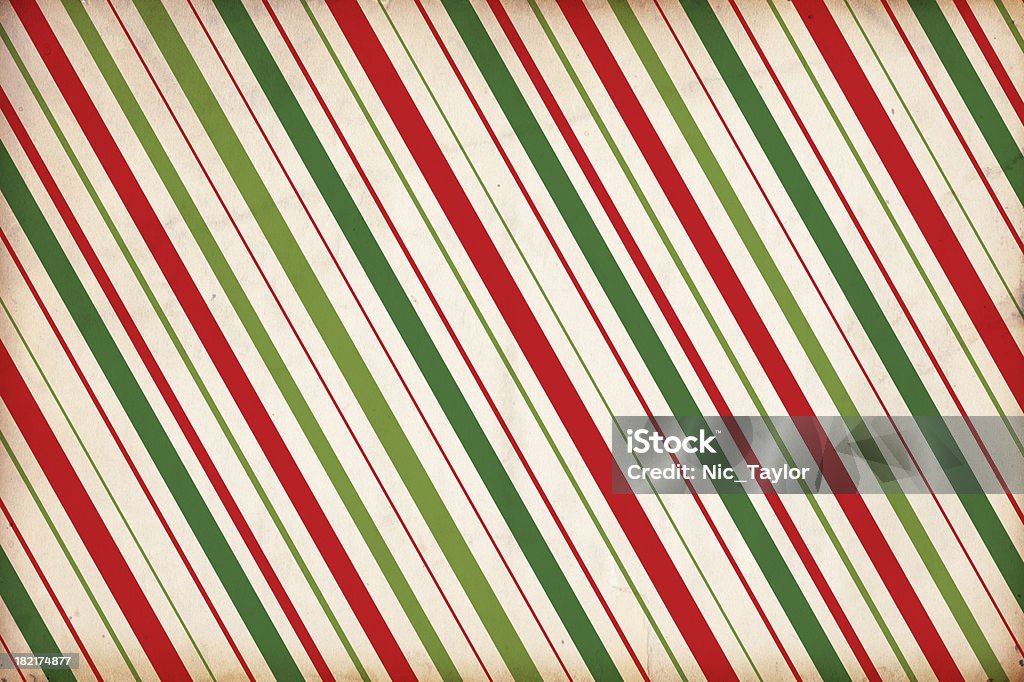 Christmas Paper Background "Image of an old, grungy piece of paper with a red and green stripe pattern. Great christmas background/design element. See more quality images like this one in my portfolio and in my Christmas background lightbox." Christmas Stock Photo