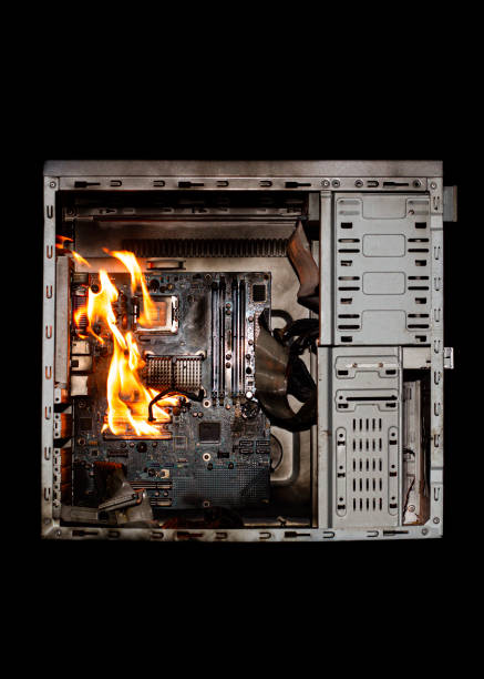 istock a burning system unit from a computer from a short circuit and a power surge on a black isolated background 1821749700