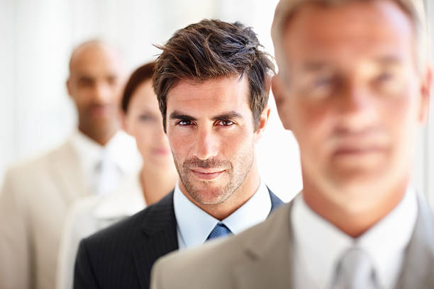 istock Businessman standing with his colleagues 182175000