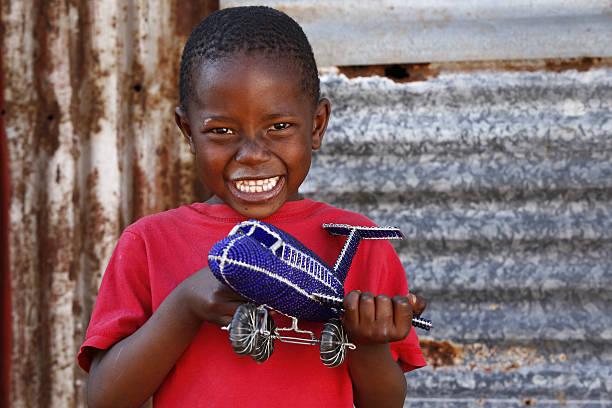 African child toy aeroplane stock photo