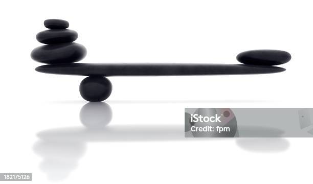 Balancing Smooth Black Stone With Reflection Stock Photo - Download Image Now - Balance, Zen-like, Buddhism