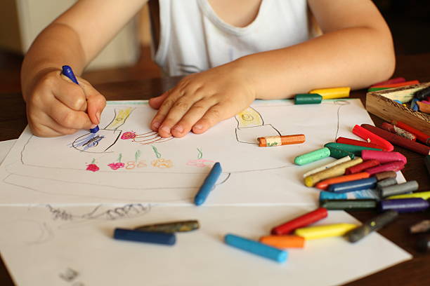 istock Young child drawing and coloring 182175133