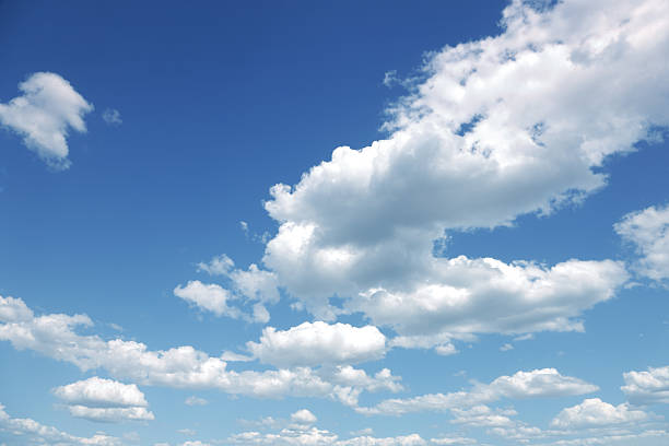 photo of some white whispy clouds and blue sky cloudscape - lucht stockfoto's en -beelden