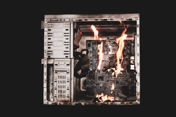 istock a burning system unit from a computer from a short circuit and a power surge on a black isolated background 1821751733