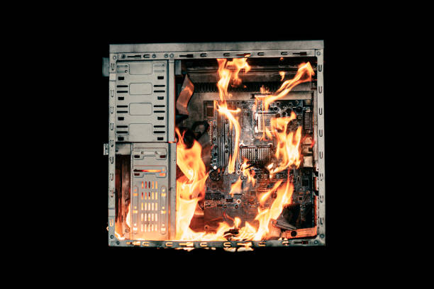 istock a burning system unit from a computer from a short circuit and a power surge on a black isolated background 1821751734