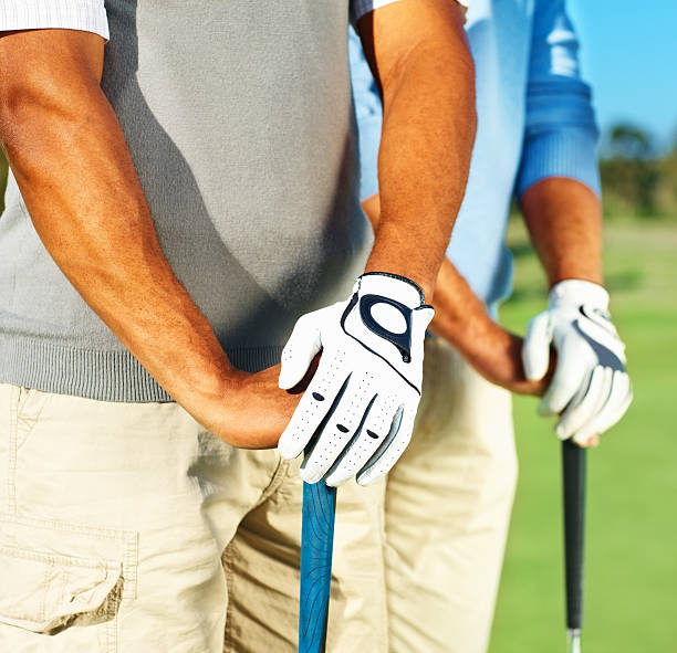 istock Midsection of two professional golfers 182175323