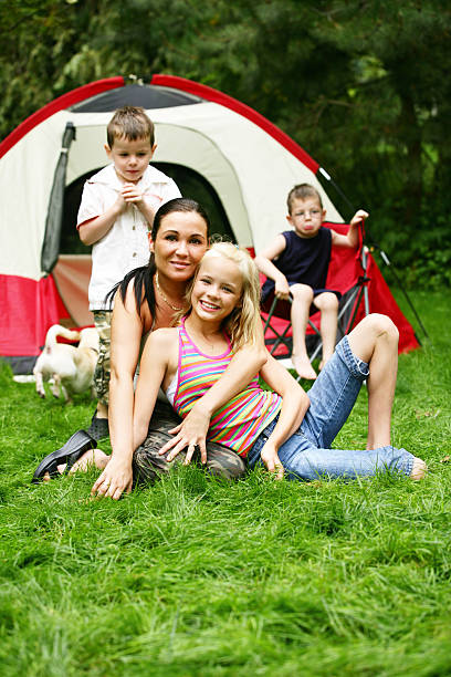Mother at camping site with family