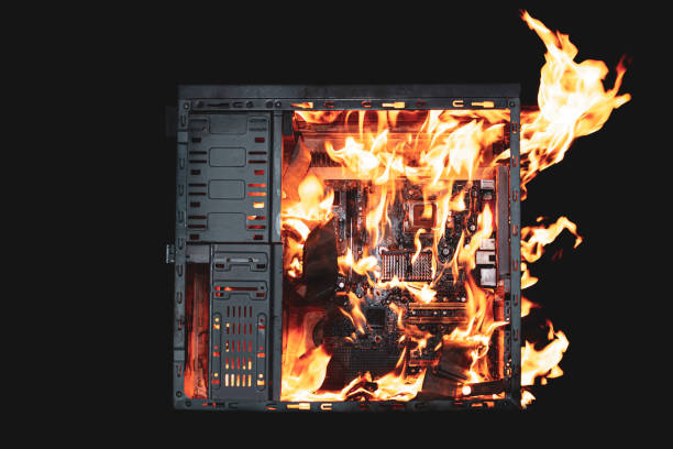 istock a burning system unit from a computer from a short circuit and a power surge on a black isolated background 1821754865