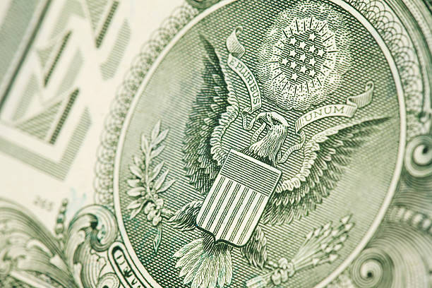 One Dollar Bill &amp; The Great Seal "An extreme close up of the Great Seal of the United States of America as featured on a one dollar bill. Taken at an angle with a macro lens on a 21MP camera. Shallow DOF, selective focus on the eagles head and it's surrounding. Please zoom in to see the details. (Adobe RGB, Canon 5D Mark II)" american one dollar bill photos stock pictures, royalty-free photos & images