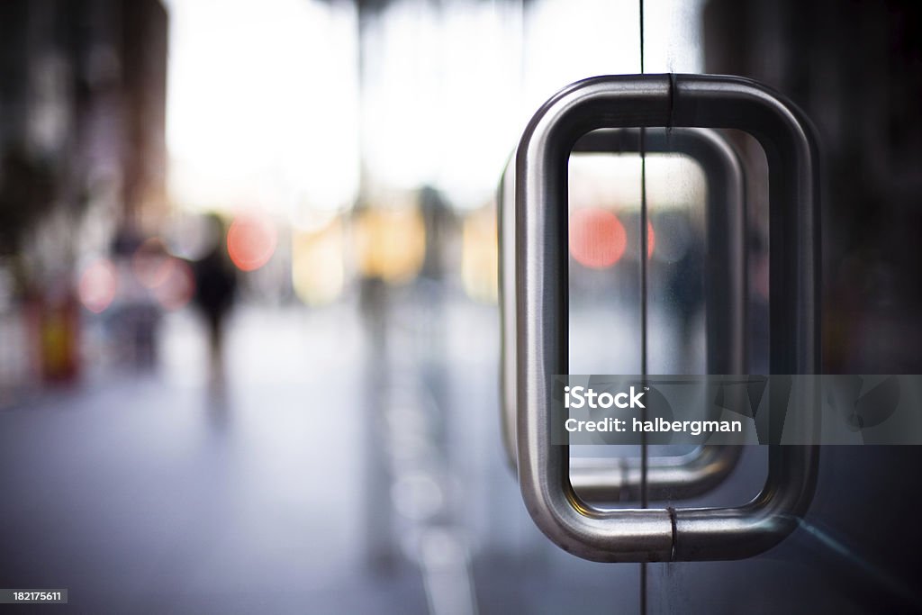 Door Handles on a Glass Office Building Door Stock Photo