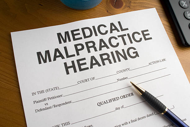 istock Medical malpractice hearing form and pen 182175934