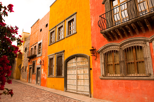 Building along a cobblestone street in the town of San Miguel de Allende, Mexico.View More: