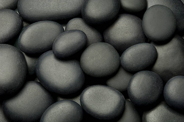 Spa Stones Black Spa Stone Background. hot stone massage stock pictures, royalty-free photos & images