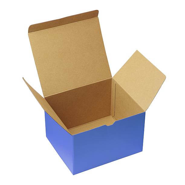 close-up of blue rectangular cardboard box or shoe box isolated white background, blank label on one side, mock-up template