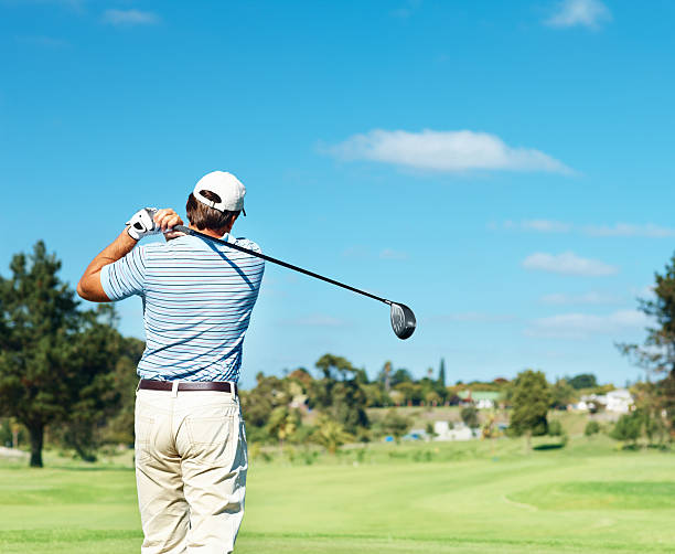 istock Rear view of a professional golfer practicing 182176354