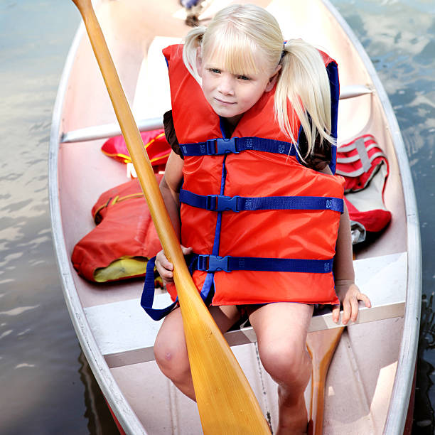 istock Little girl in canoe 182176528