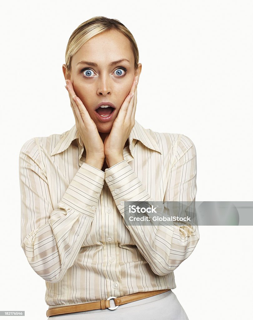 Close-up of a businesswoman looking shocked Close-up of a businesswoman looking shocked over white background Surprise Stock Photo