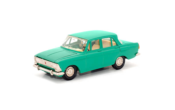 teal toy car on white background - speelgoedauto stockfoto's en -beelden