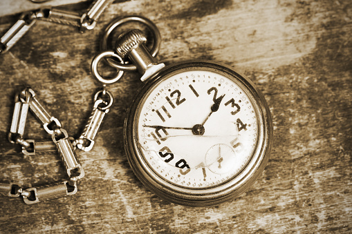A silver antique pocket watch with a clipping path.