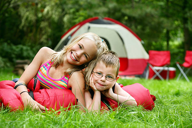 istock Brother and sister on camping site 182176753