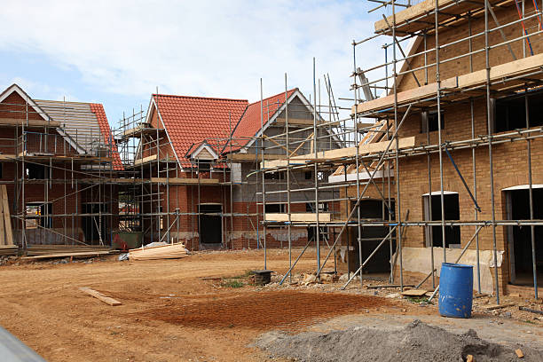 istock New houses under construction on a building site 182177048