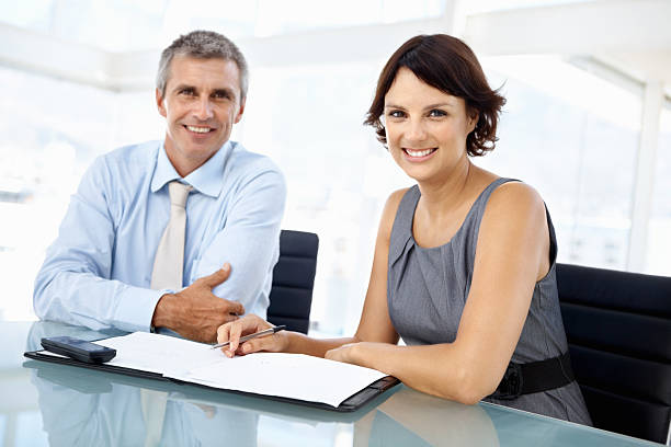 istock Business partners smiling together 182177165