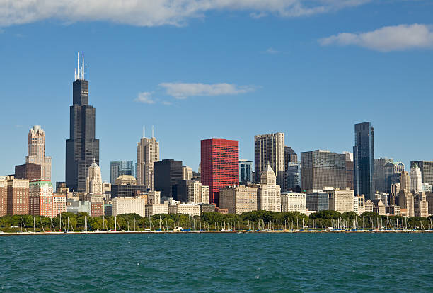 Chicago Skyline Chicago skyline with famous skyscraper- Sears Tower and other office and apartment buildings with Grant Park and boats moored in Chicago Harbor on a  sunny summer dayCheck out my Chicago Lightbox with more images: willis tower stock pictures, royalty-free photos & images