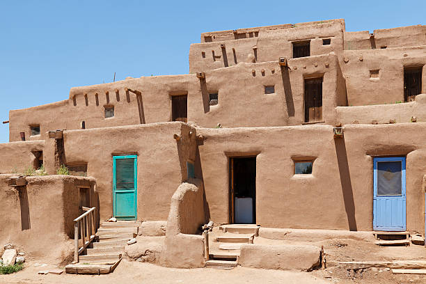 Pueblo Architecture "Pueblo architecture (Taos, New Mexico)." adobe material stock pictures, royalty-free photos & images