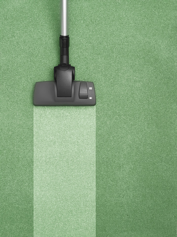 vacuuming green carpet