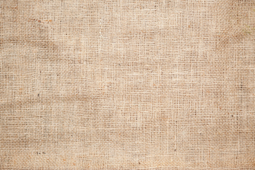 Color photo of the texture of a brown burlap potato sack.