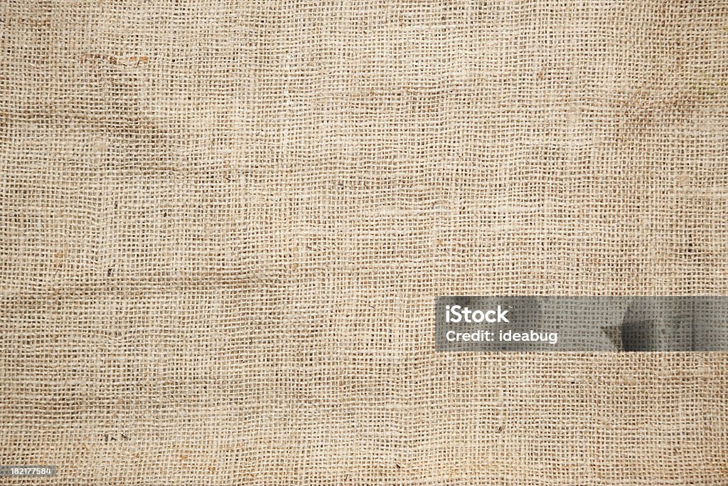 Brown Burlap Texture Background Color photo of the texture of a brown burlap potato sack. Burlap Stock Photo