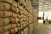 Warehouse full of sacks stacked from floor to ceiling