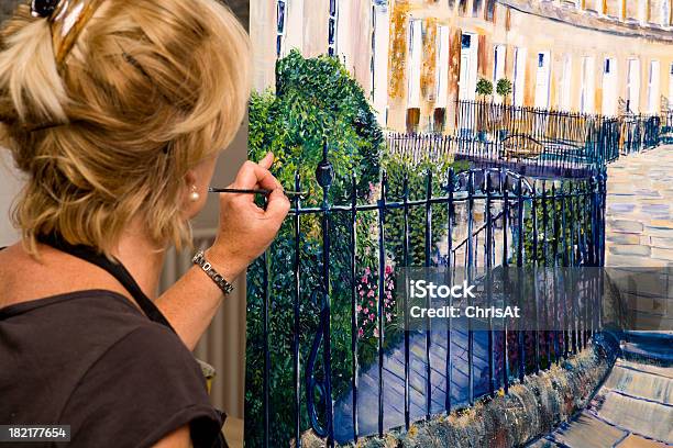 Lady Artist At Work Painting A Large Acrylic Artwork Stock Photo - Download Image Now