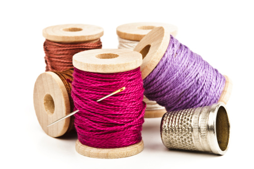 High resolution stock photograph of different thread spools with a needle and thimble.Please see some similar pictures from my portfolio: