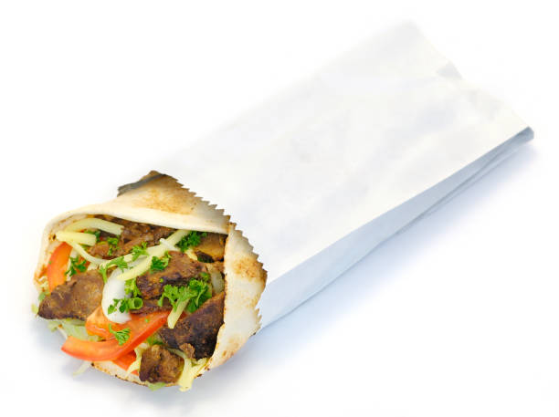 istock Wrapped kebab served in a white paper bag 182178140