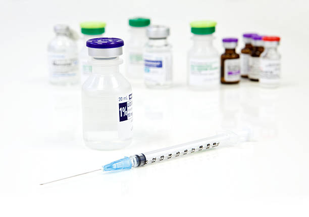 Рroduction of medicines. lot of ampoules on light background.