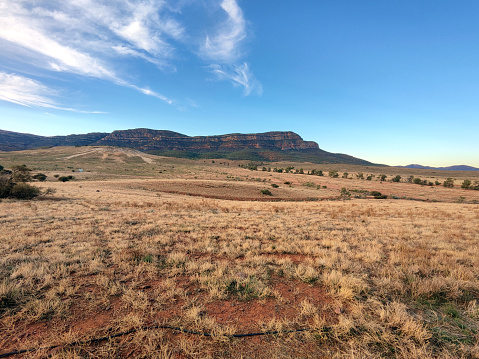 Rawnsley Bluff, a geological feature in Flinders Ranges National Park viewed at sunset from Station Hill Lookout. The Flinders Ranges are the largest mountain ranges in South Australia.
