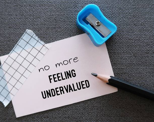 istock Note with pencil writing No More Feeling Undervalued - to overcome feeling unappreciated when contribution not recognized at work or in relationship - hard work and achievements go unnoticed 1821784931