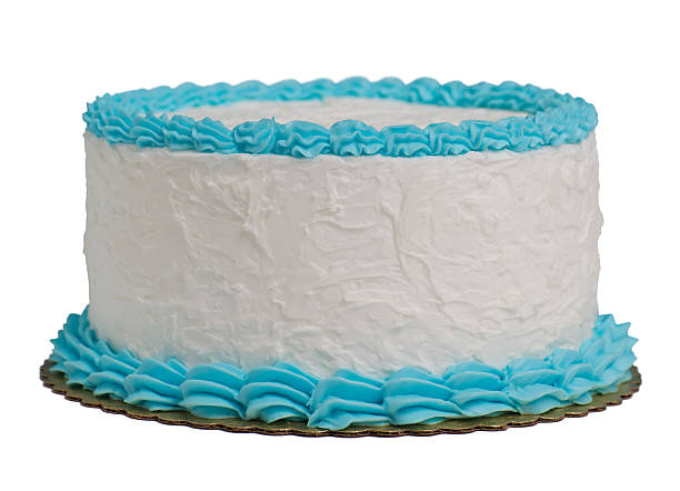 A large round cake with blue and white frosting isolated stock photo