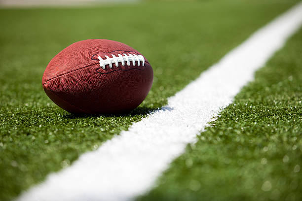 istock American football on the turf 182178678