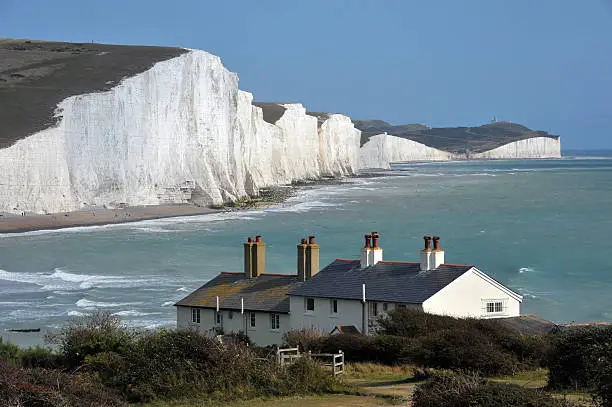 "A view of the white cliffs of Southern England.The Seven Sisters white cliffs with coast guard cottagesSussex, England"