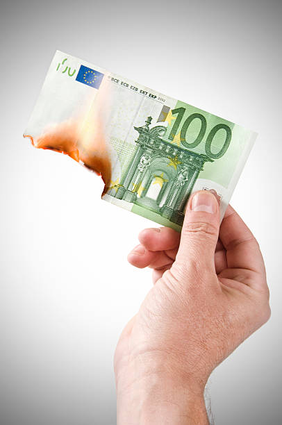 burning マネー - european union euro note european union currency paper currency currency ストックフォトと画像