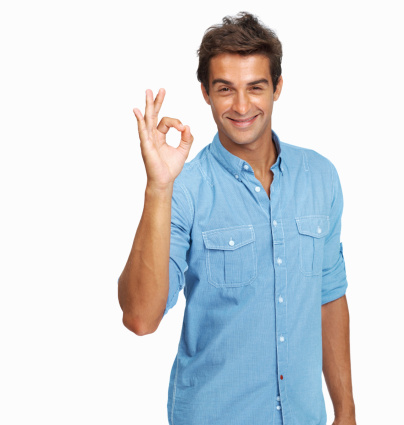 Portrait of handsome young man gesturing the okay sign