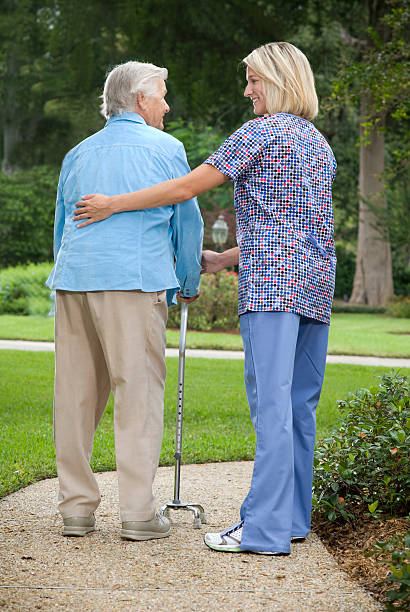 istock Senior lady with home care nurse 182179235