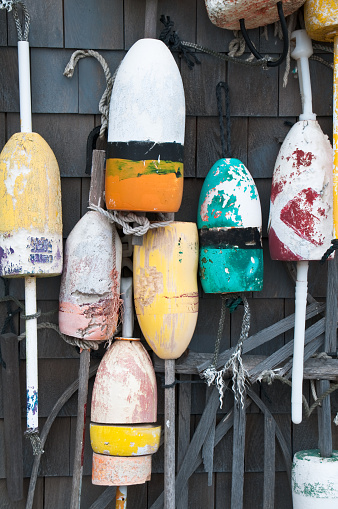 Old lobster Lobster Bouys nailed to a fishing shack in Rock Harbor, (Orleans) Massachusetts