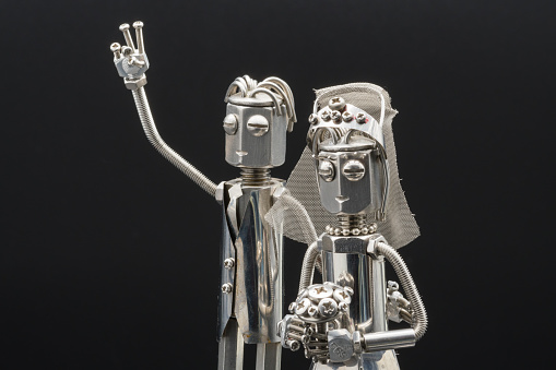 Metal figurine of a happy couple getting married