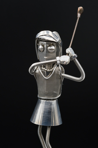 female golfer metal figure.