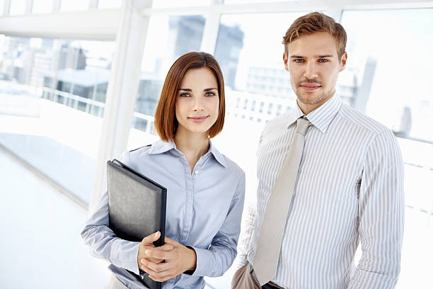 istock Young, smiling business people 182180087