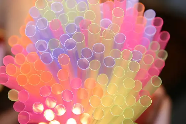 Colourful straws (abstract). Shot with a flashlight shining up through the straws